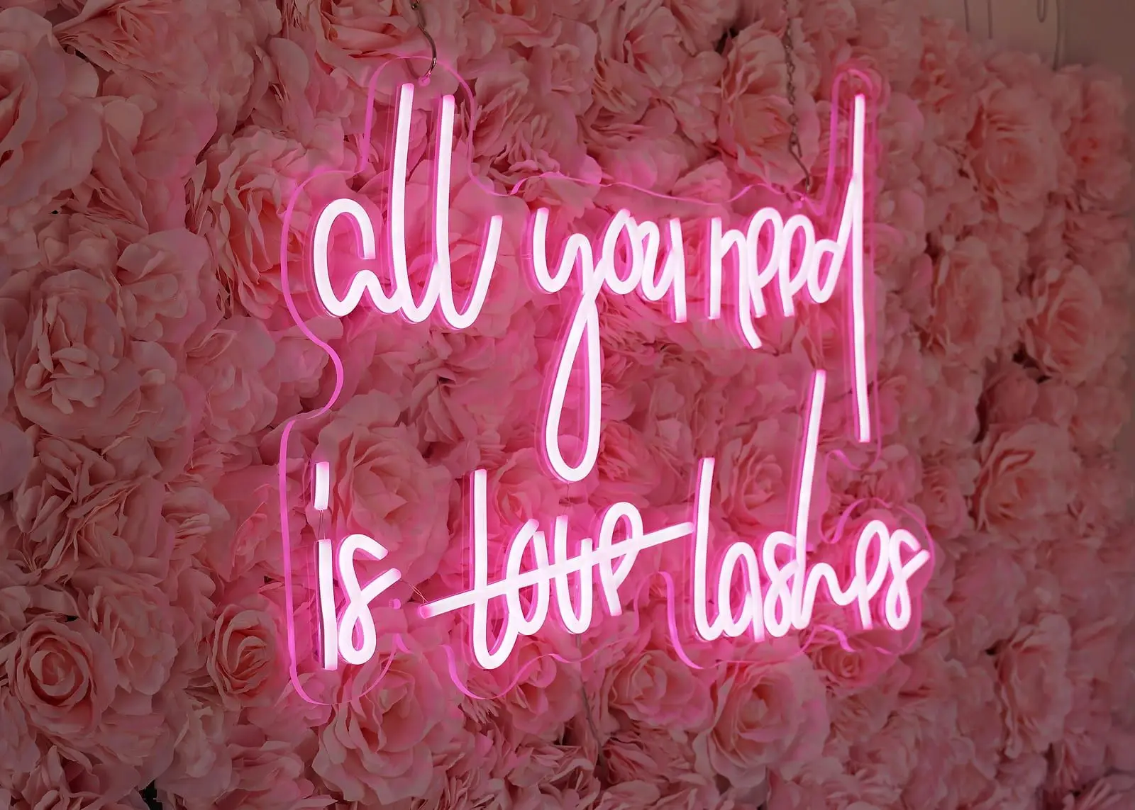 The sign at Eye Charm, Hyde Park Austin — The studio's real neon.