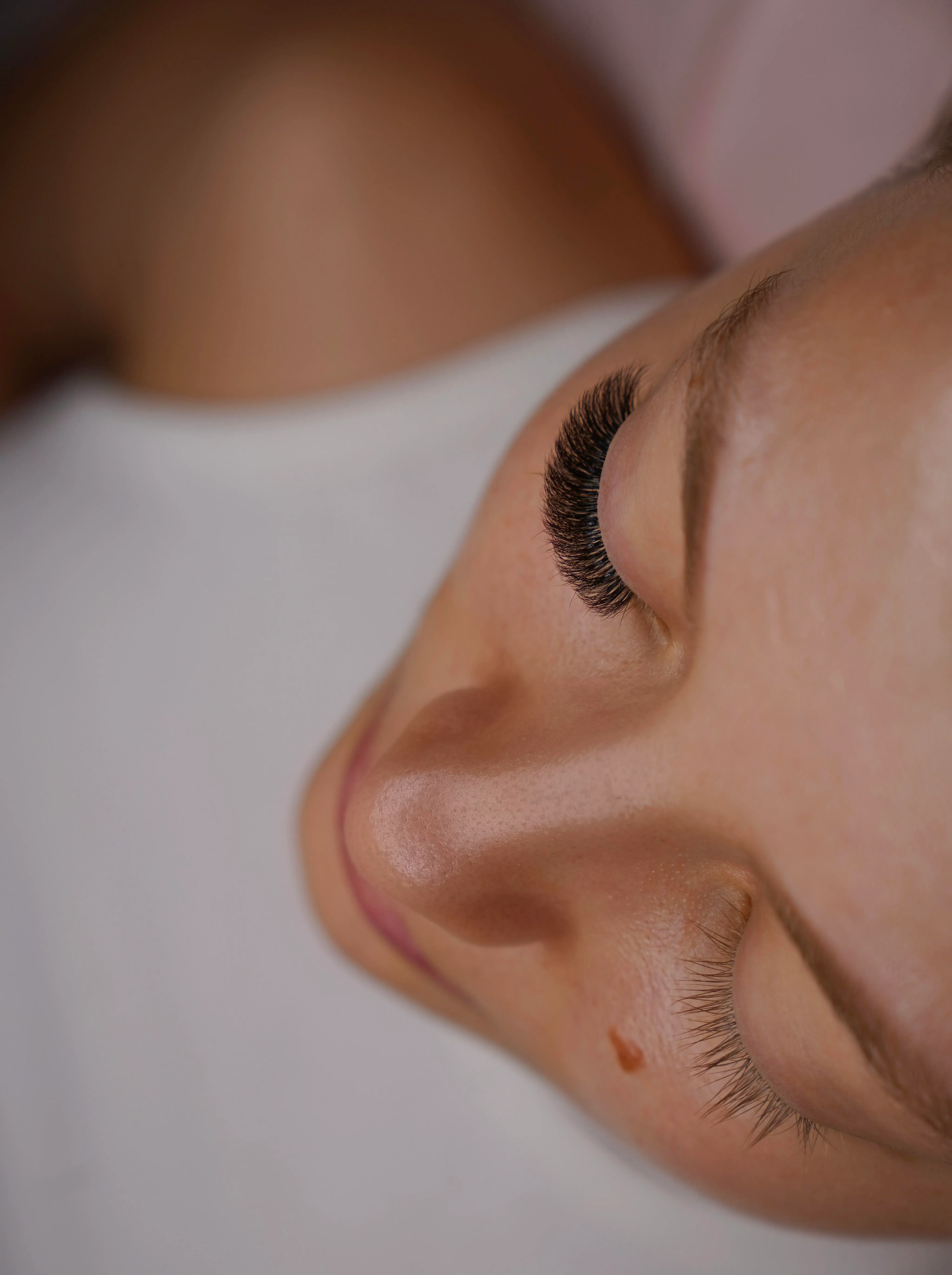 Profile close-up of a handmade volume lash set at Eye Charm in Hyde Park, Austin