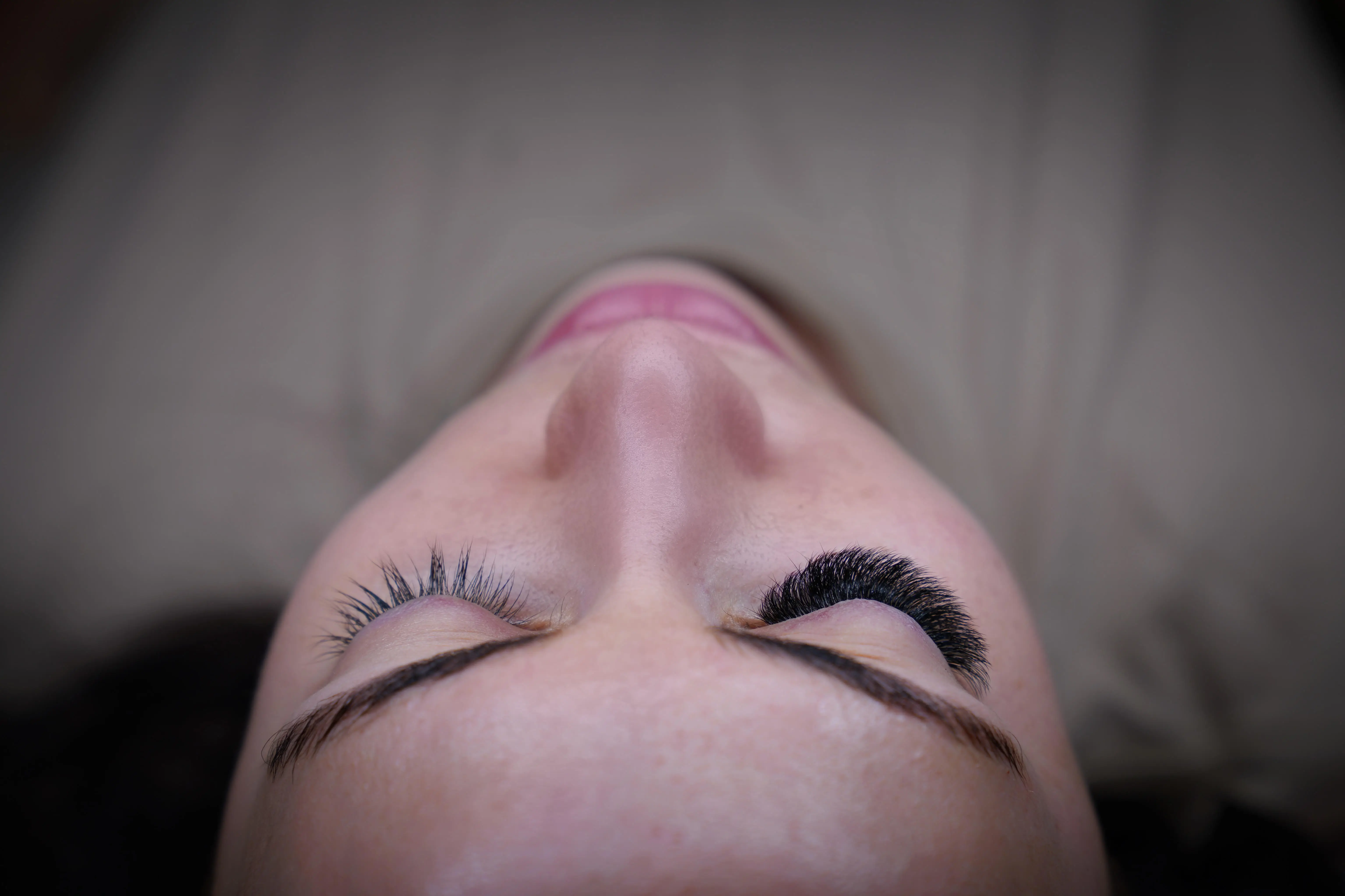 Volume, overhead at Eye Charm, Hyde Park Austin — Symmetry between both eyes, checked from above before the client sits up.